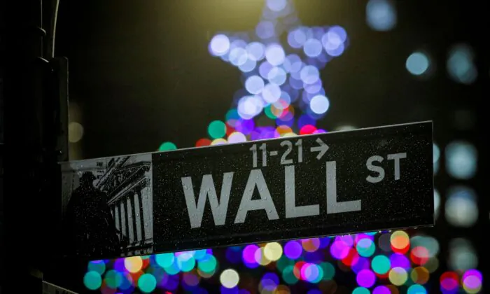 The Wall Street sign is seen outside the New York Stock Exchange (NYSE) in New York, on Dec. 17, 2019. (Brendan McDermid/Reuters)