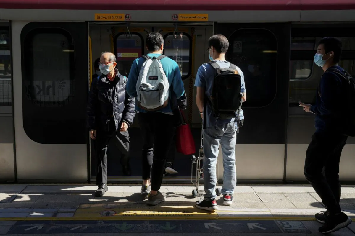 A passenger walks out of the carriage at a train station in Hong Kong, on Nov. 29, 2021. (Lam Yik/Reuters)
