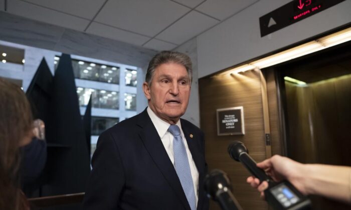 Sen. Joe Manchin (D-W. Va.), leaves his office after speaking with President Joe Biden about his long-stalled domestic agenda, at the Capitol in Washington, Dec. 13, 2021. (J. Scott Applewhite, File/AP Photo)