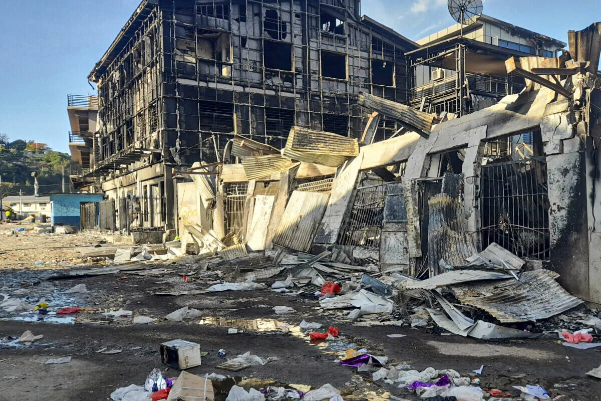 This photo shows aftermath of a looted street in Honiara's Chinatown, Solomon Islands, on Nov. 27, 2021. (Piringi Charley/AP Photo)