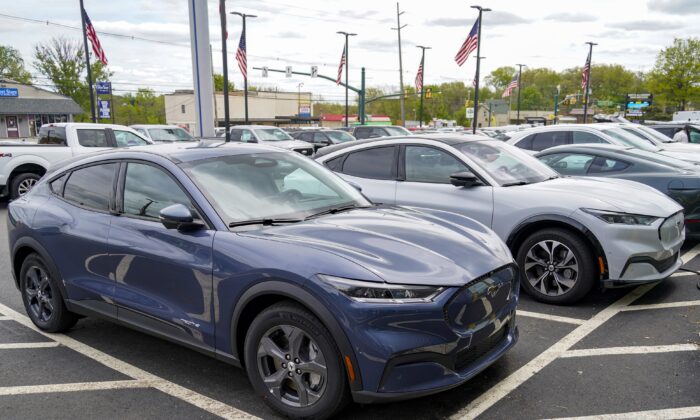 A pair of 2021 Ford Mustang Mach E are displayed for sale at a Ford dealer in Wexford, Pa., on May 6, 2021. (Keith Srakocic/AP Photo)