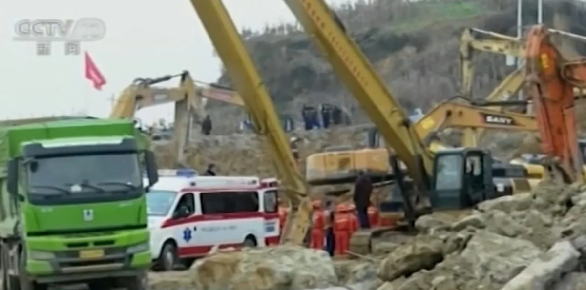 Rescue workers and excavators at a construction site hit by a landslide in Bijie city, Guizhou Province, southwestern China, on Jan. 4, 2022. (CCTV via AP/Screenshot via The Epoch Times)
