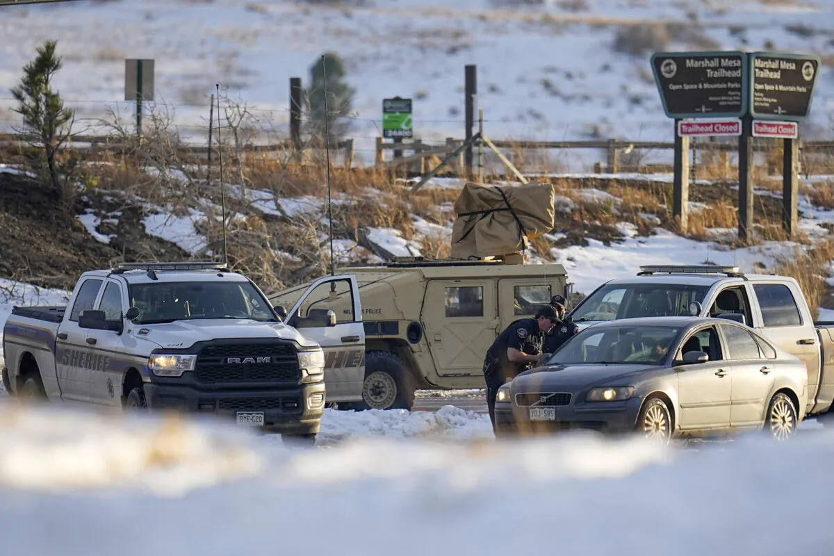 Boulder County Sheriff's officers work a road block at the suspected origin of the Marshall wildfire in Boulder, Colo., on Jan. 3, 2022. (Jack Dempsey/AP Photo)