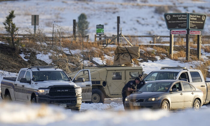 Boulder County Sheriff's officers work a road block at the suspected origin of the Marshall wildfire in Boulder, Colo., on Jan. 3, 2022. (Jack Dempsey/AP Photo)