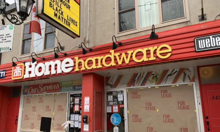 A storefront on Roncesvalles Avenue displays a "for lease" sign as part of a protest against the Ontario government's pandemic lockdown rules, in Toronto on Nov. 24, 2020. (The Canadian Press/Jody White)