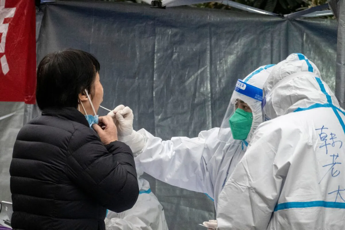 A resident undergoes a nucleic acid test for COVID-19 in Xi'an, northwestern China’s Shaanxi Province on Jan. 4, 2022. (STR/AFP via Getty Images)