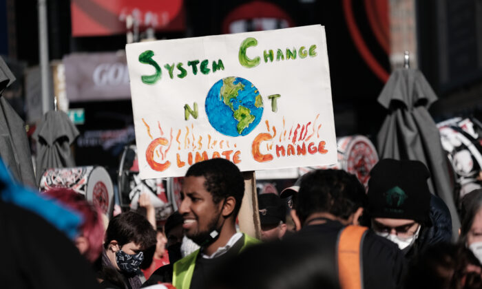 Hundreds of climate protesters walk from Times Square to New York Governor Kathy Hochul’s office to demand more action against climate change in New York City on Nov. 13, 2021. (Spencer Platt/Getty Images)