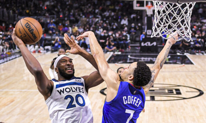 Minnesota Timberwolves forward Josh Okogie (L) shoots as Los Angeles Clippers guard Amir Coffey defends during the second half of an NBA basketball game in Los Angeles on Jan. 3, 2022. (Mark J. Terrill/AP Photo)