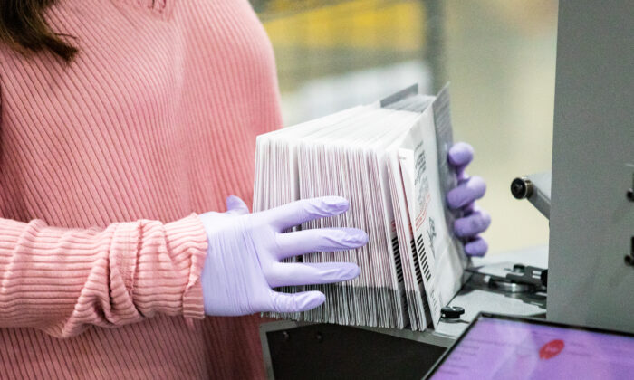 People count ballot votes in a file photo. (John Fredricks/The Epoch Times)