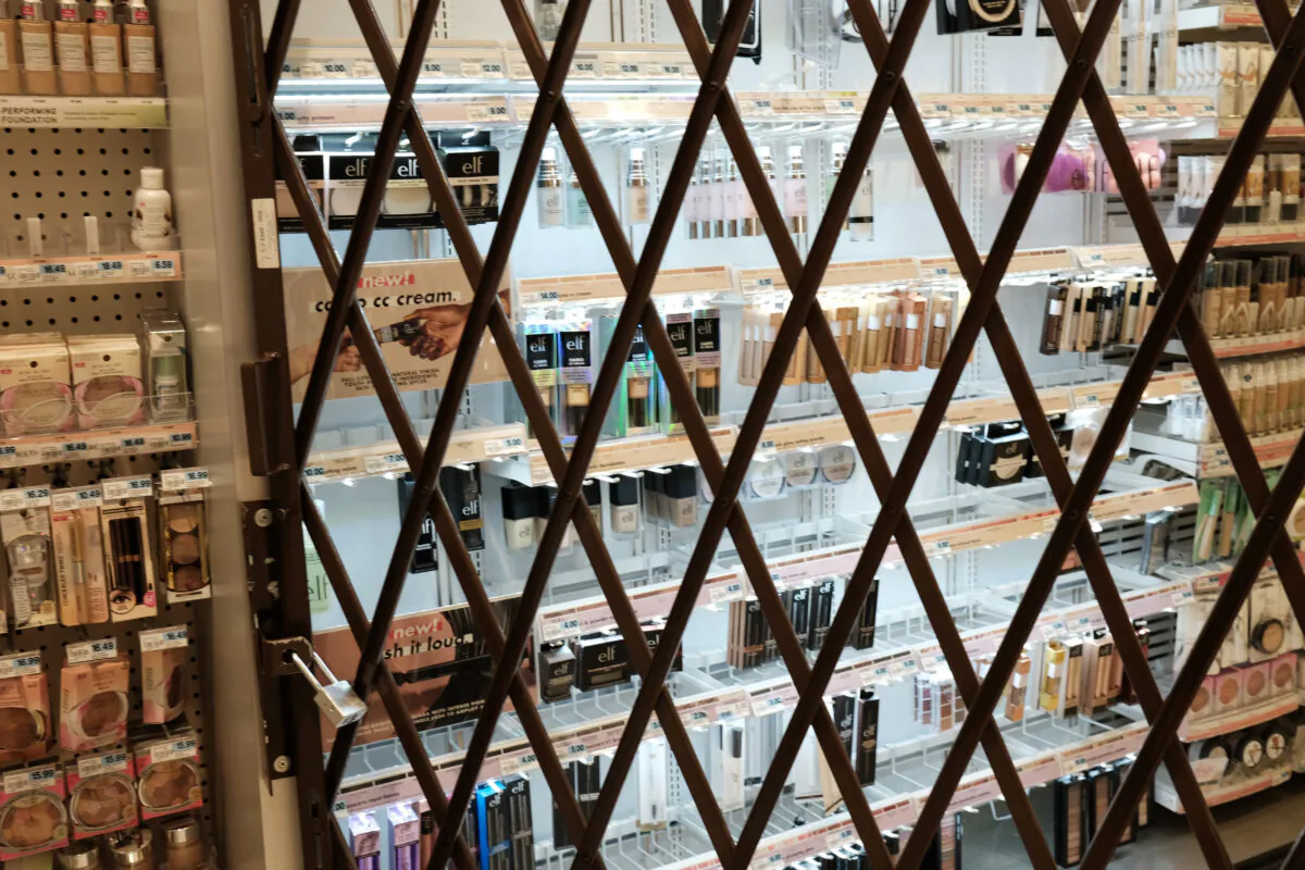 A gate is used to lock items at a pharmacy and convenience store in New York City on Oct. 26, 2021. (Spencer Platt/Getty Images)