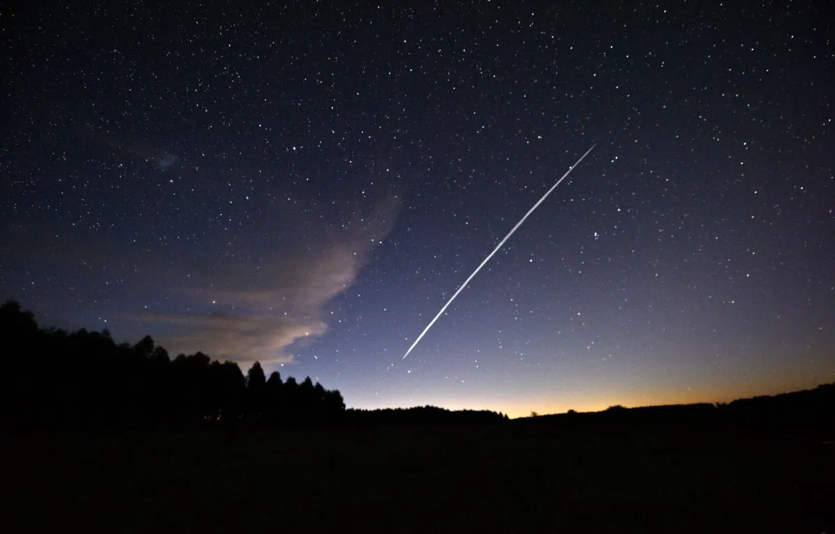 This long-exposure image shows the trail of a group of SpaceX's Starlink satellites passing over Uruguay as seen from the countryside near Capilla del Sauce on Feb. 7, 2021. (Mariana Suarez/AFP via Getty Images)
