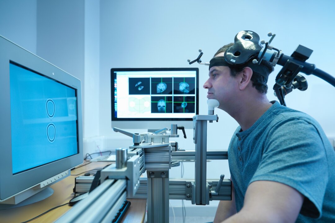 For those unable to resolve their depression through other means, an electromagnetic coil placed on their head may offer relief. (Image Source Trading Ltd/Shutterstock)