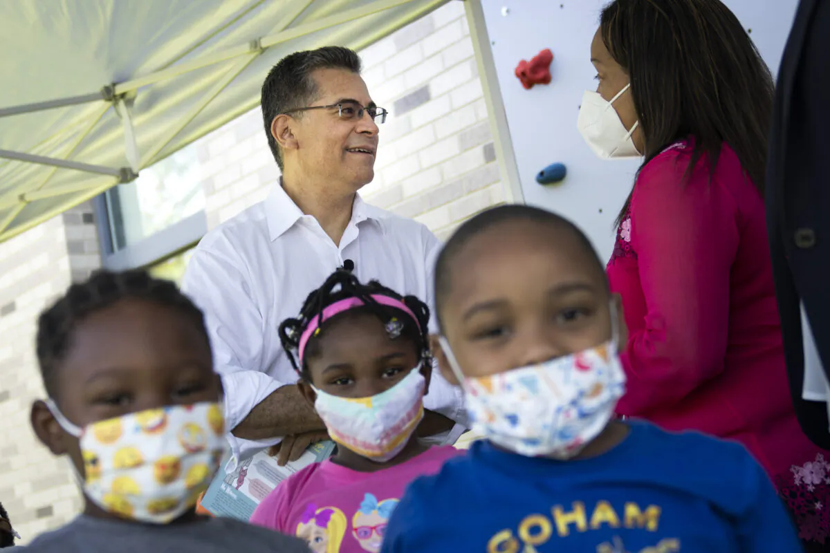 Masked children are seen as Health Secretary Xavier Becerra tours a Head Start program in Washington on June 30, 2021. (Drew Angerer/Getty Images)