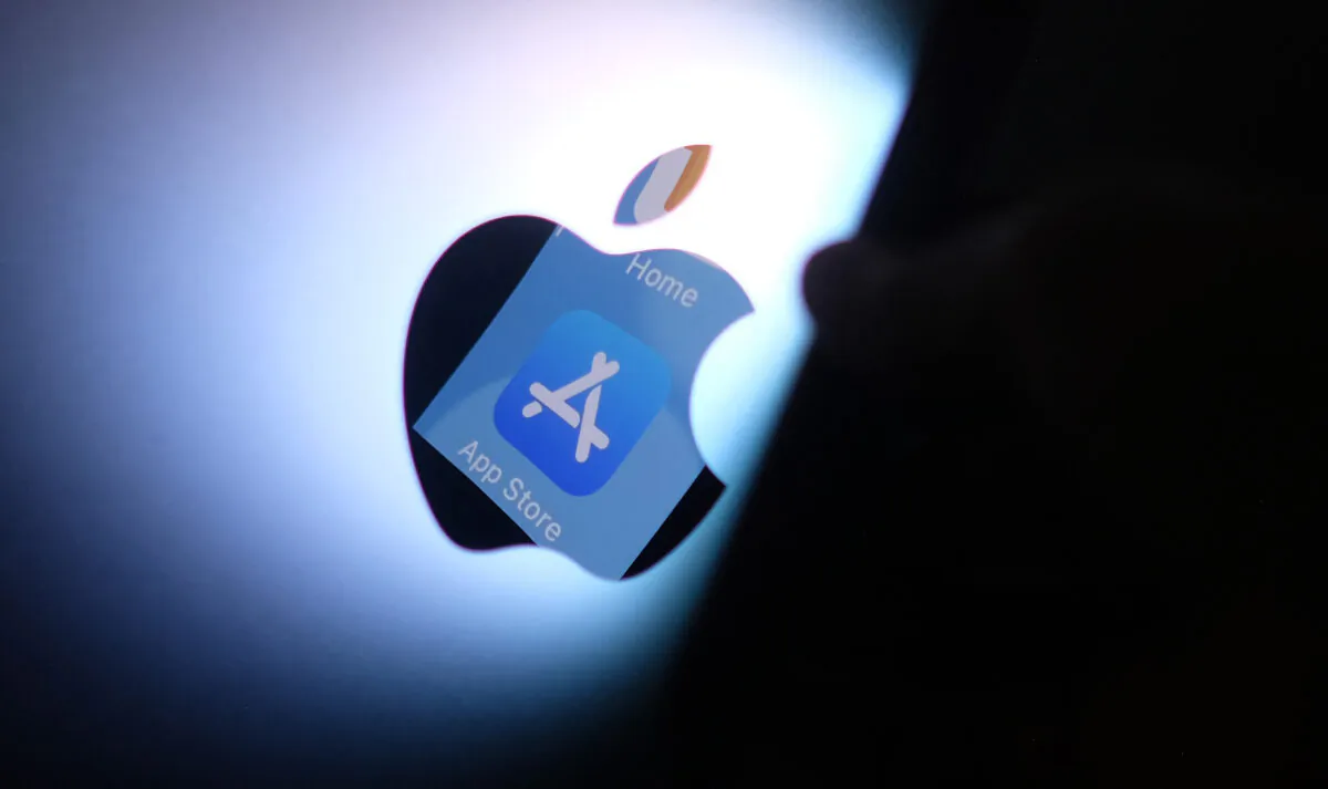 The Apple app store logo is reflected from an iPhone onto the back of an iMac in this illustration photo, in Los Angeles, on Aug. 26, 2021. (Chris Delmas/AFP via Getty Images)