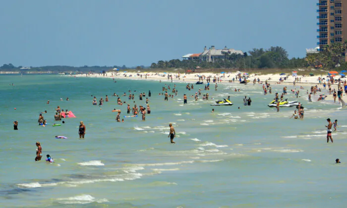 People visit Clearwater Beach in Clearwater, Fla., on May 4, 2020. (Mike Ehrmann/Getty Images)
