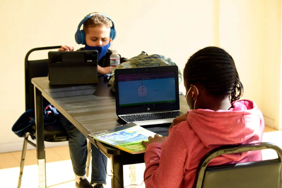 Children attend online classes at a learning hub inside the Crenshaw Family YMCA in Los Angeles, Calif., on Feb. 17, 2021. (Patrick T. Fallon/AFP via Getty Images)