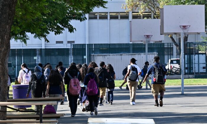 Students walk to their classrooms at a public middle school in Los Angeles on Sept. 10, 2021. (Robyn Beck/AFP via Getty Images)