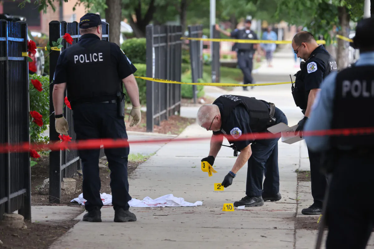 Police investigate a crime scene in a file photo taken in Illinois. (Scott Olson/Getty Images)