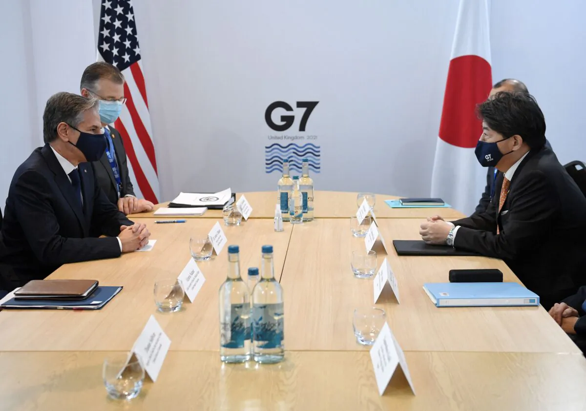 U.S. Secretary of State Antony Blinken (L) and Japan's Foreign Minister Yoshimasa Hayashi (R) hold a bilateral meeting at the G7 foreign ministers summit in Liverpool, north-west England, on Dec. 11, 2021. (Olivier Douliery/AFP via Getty Images)