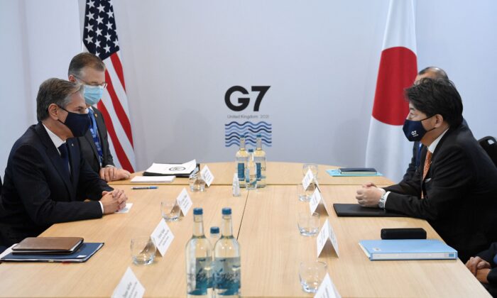 U.S. Secretary of State Antony Blinken (L) and Japan's Foreign Minister Yoshimasa Hayashi (R) hold a bilateral meeting at the G7 foreign ministers summit in Liverpool, north-west England, on Dec. 11, 2021. (Olivier Douliery/AFP via Getty Images)