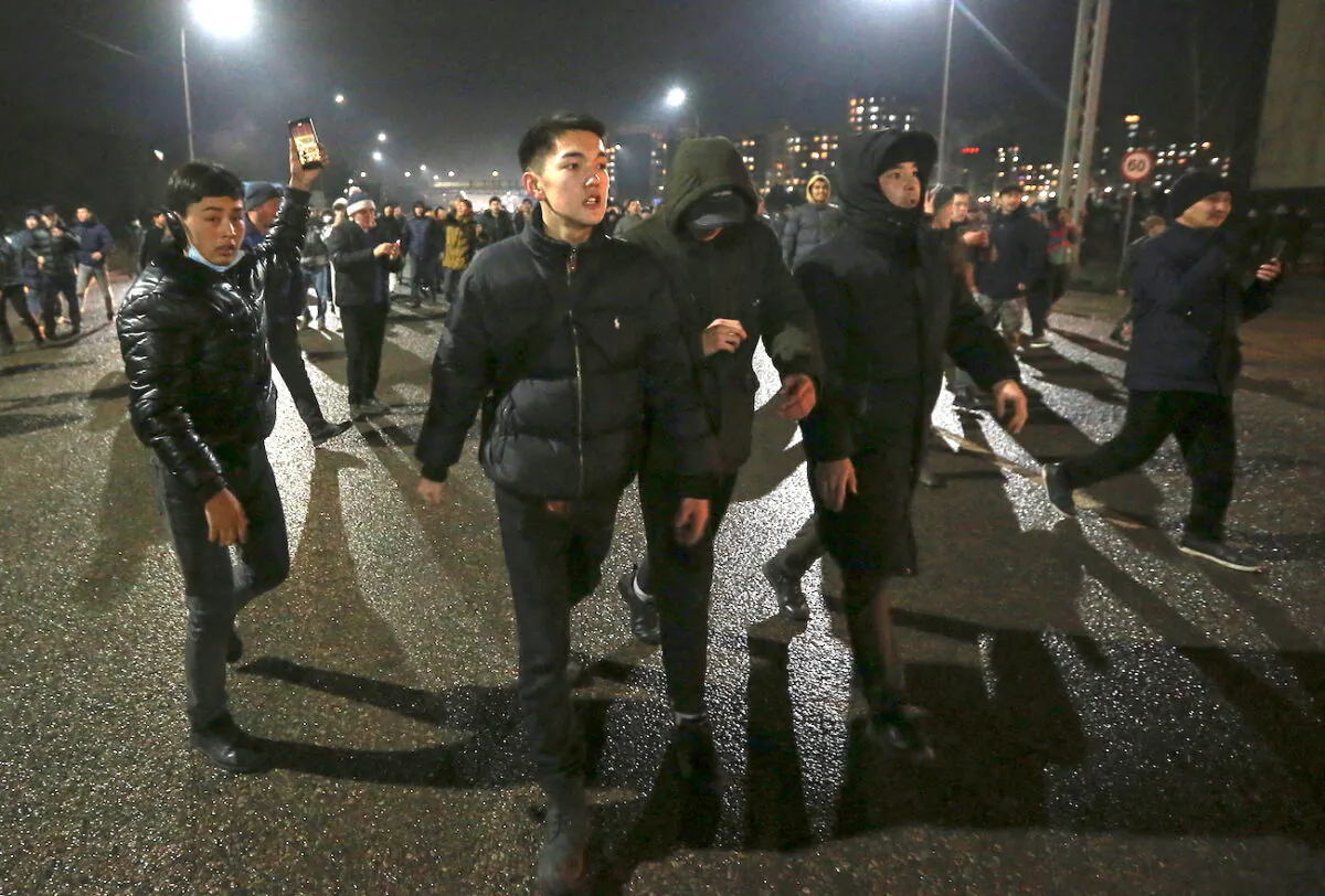 People take part in a protest against LPG cost rise following the Kazakh authorities' decision to lift price caps on liquefied petroleum gas in Almaty, Kazakhstan, on Jan. 4, 2022. (Pavel Mikheyev/Reuters)