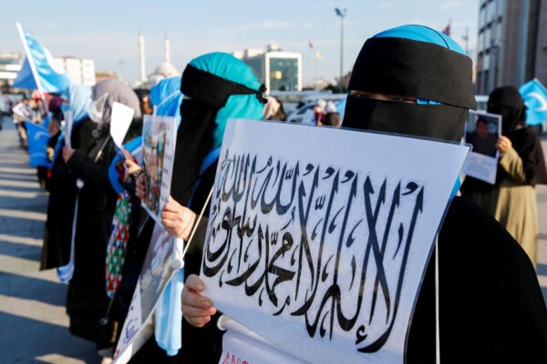 Uyghur women take part in a protest against China
