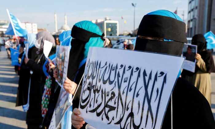 Ethnic Uyghur women take part in a protest against China, in front of the Caglayan Courthouse, in Istanbul, Turkey, on Jan. 4, 2022. (Dilara Senkaya/Reuters)