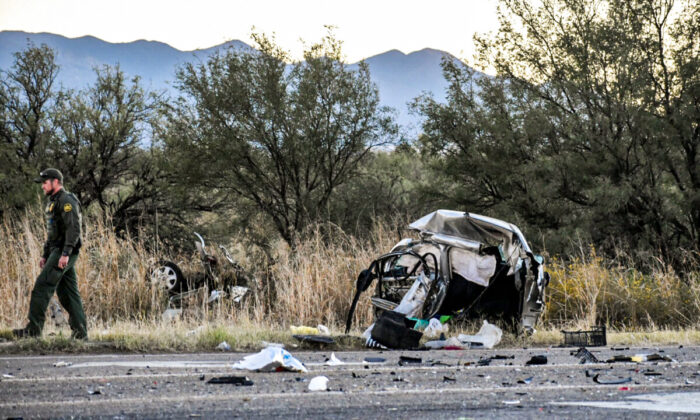 A Border Patrol agent walks from the wreckage of Wanda Sitowski’s car after a 16-year-old smuggler ran a red light at 105 miles per hour and caused a fatal crash in Cochise County, Ariz., on Oct. 30, 2021. (Zach Bennett/Sierra Vista News Network)