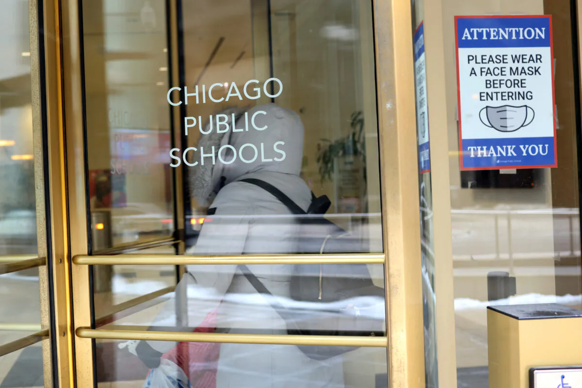 A sign is displayed at the entrance of the headquarters for Chicago Public Schools in Chicago, Ill., on Jan. 5, 2022. (Scott Olson/Getty Images)