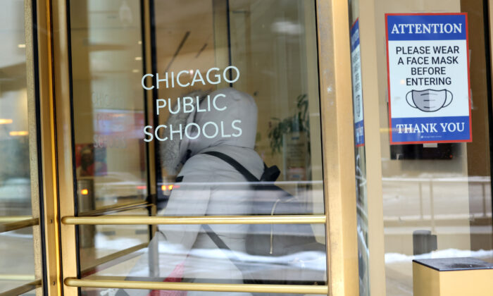 A sign is displayed at the entrance of the headquarters for Chicago Public Schools on Jan. 5, 2022. (Scott Olson/Getty Images)