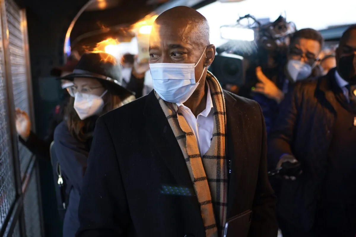 New York City Mayor Eric Adams watches a fight in New York on Jan. 1, 2022. (Seth Wenig/AP Photo)