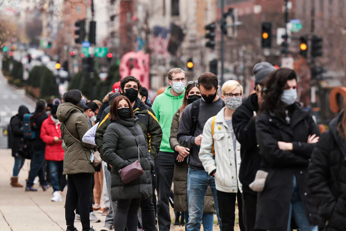People wait in line at a testing site to receive a free COVID-19 PCR test in Farragut Square in Washington on Dec. 28, 2021. (Anna Moneymaker/Getty Images)