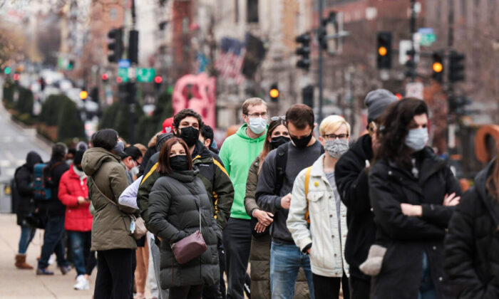 People wait in line at a testing site to receive a free COVID-19 PCR test in Farragut Square in Washington, on Dec. 28, 2021. (Anna Moneymaker/Getty Images)