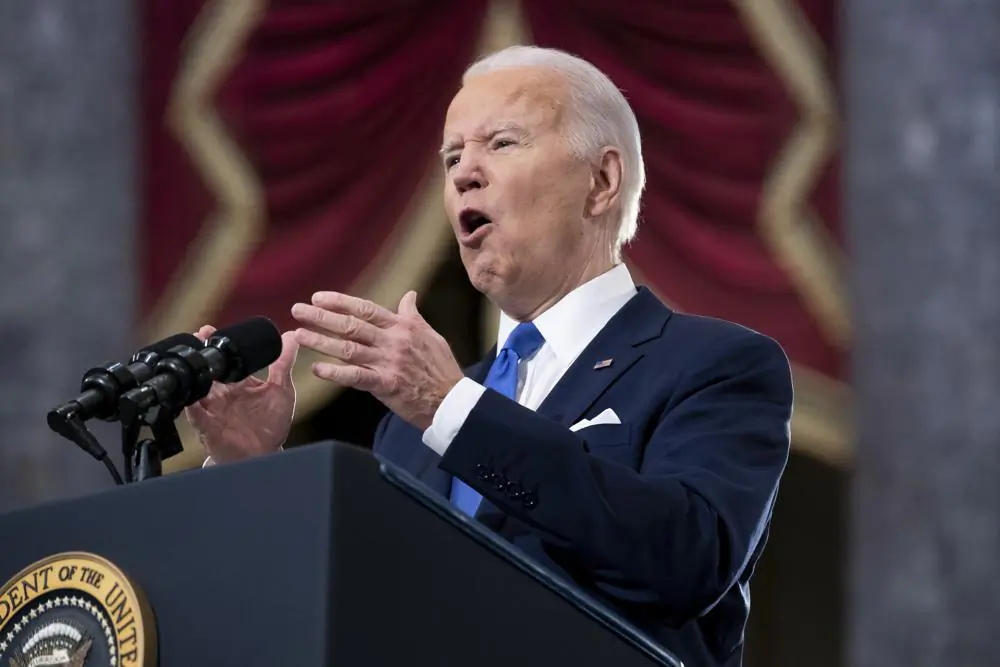 President Joe Biden speaks from Statuary Hall at the U.S. Capitol to mark the one year anniversary of the Jan. 6 riot at the U.S. Capitol by supporters loyal to then-President Donald Trump, Thursday, Jan. 6, 2022. (Michael Reynolds/Pool via AP)