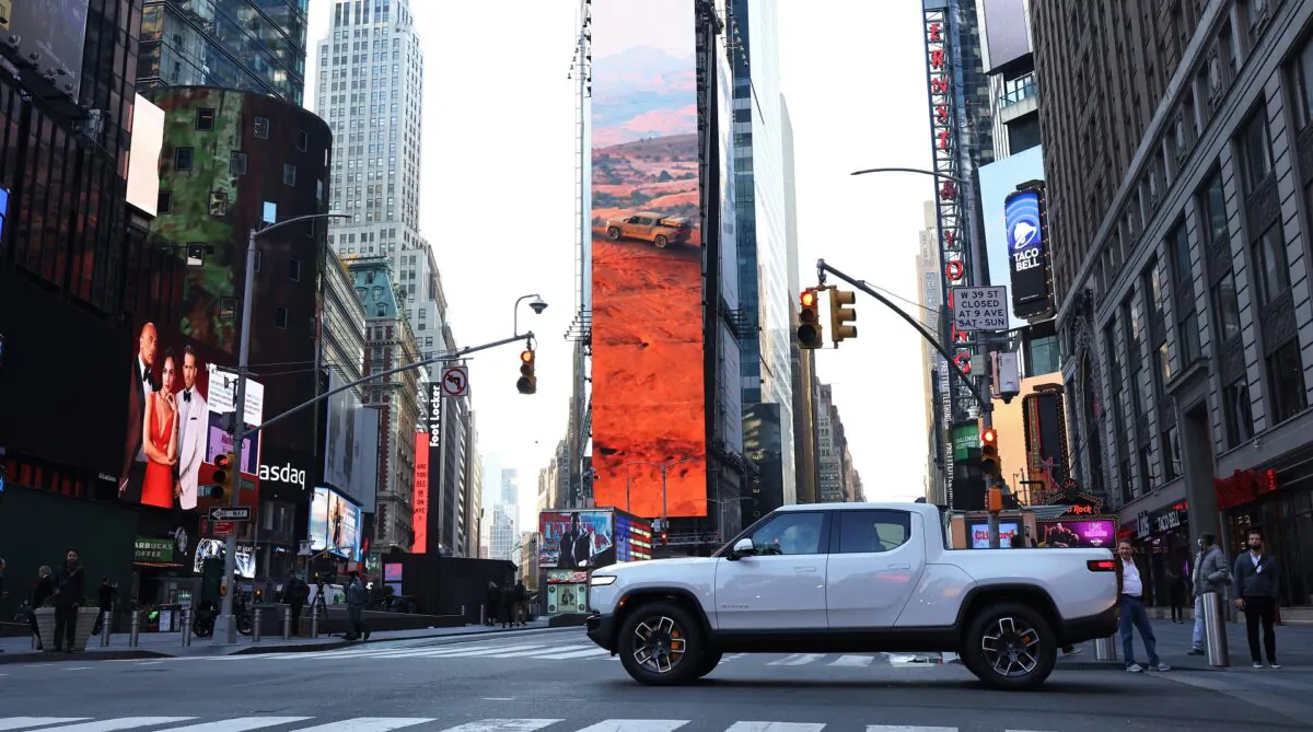 A Rivian electric truck is seen, as it drives through 44th Street in Times Square, New York City, N.Y., on Nov. 10, 2021. (Michael M. Santiago/Getty Images)