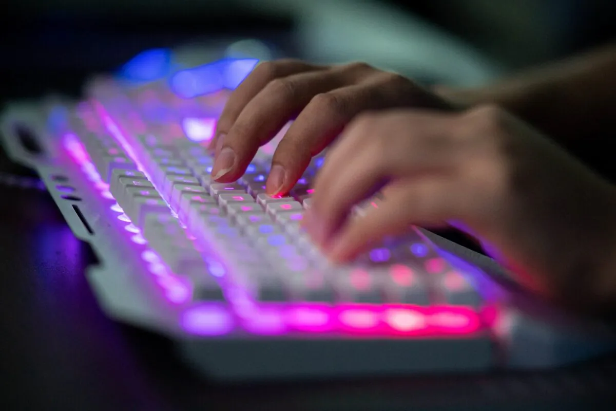 File photo of a hacker on his computer. (Nicolas Asfouri/AFP via Getty Images)