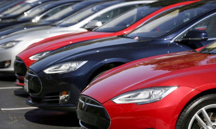 A row of Tesla Model S sedans are seen outside the company's headquarters in Palo Alto, Calif., on April 30, 2015. (Elijah Nouvelage/Reuters)