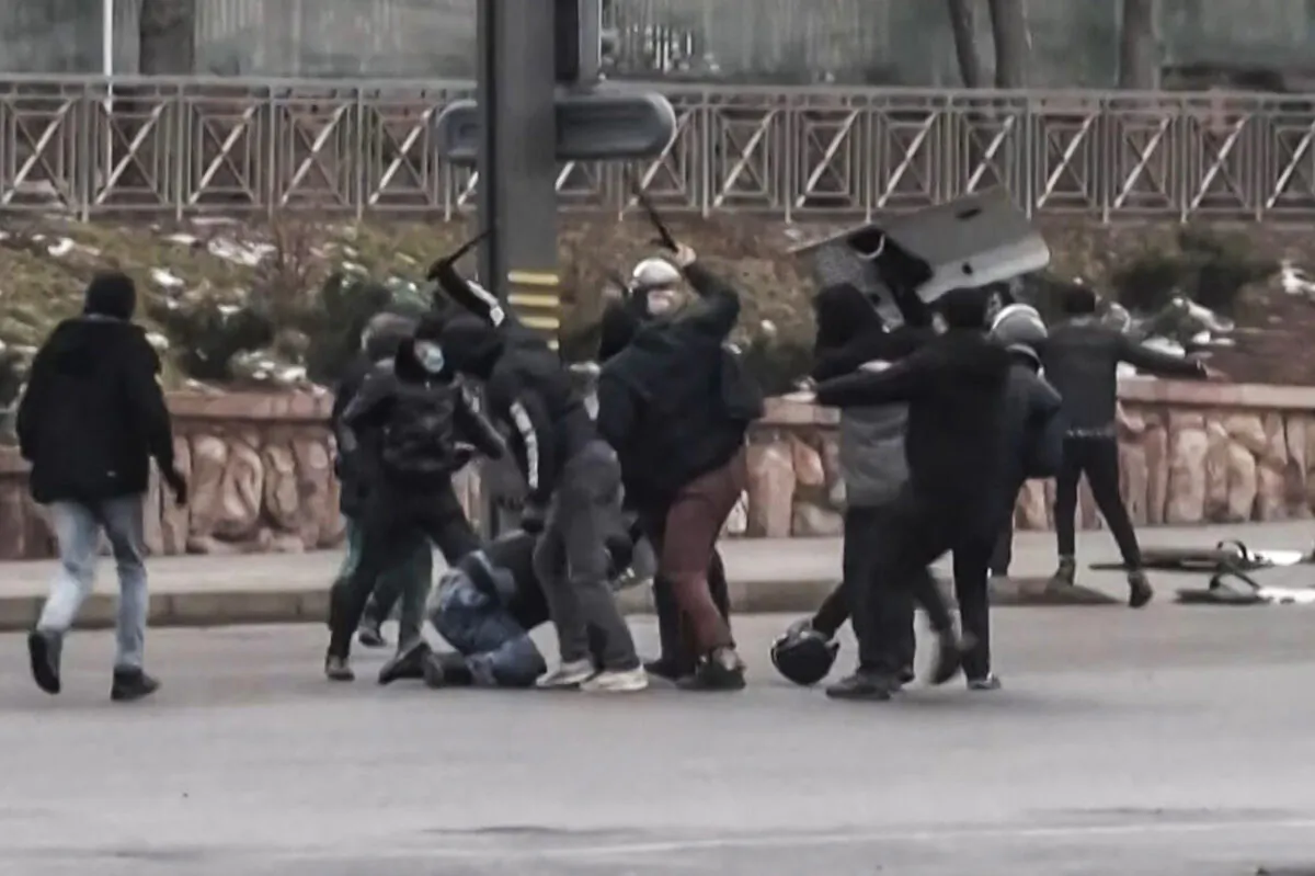 A frame grab taken on Jan. 6, 2022 from an AFPTV video made on Jan. 5, 2022, shows protesters clashing with Kazakhstan's security forces during a demonstration in the country's largest city Almaty as unprecedented unrest in the Central Asian nation spins out of control due to a hike in energy prices. (ALEXANDER PLATONOV/AFPTV/AFP via Getty Images)
