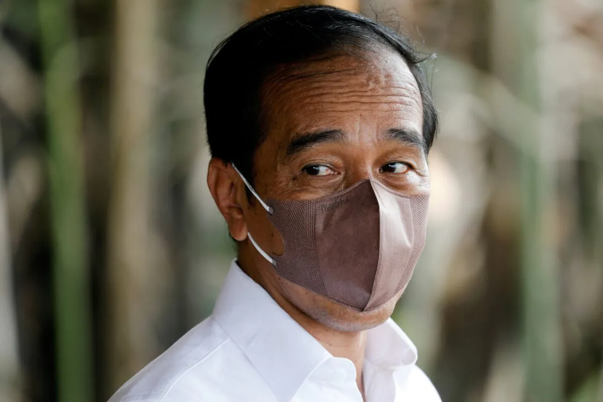 Indonesian President Joko Widodo looks on wearing a protective face mask during an interview in Bebatu, North Kalimantan province, Indonesia, on Oct.19, 2021. (Willy Kurniawan/Reuters)