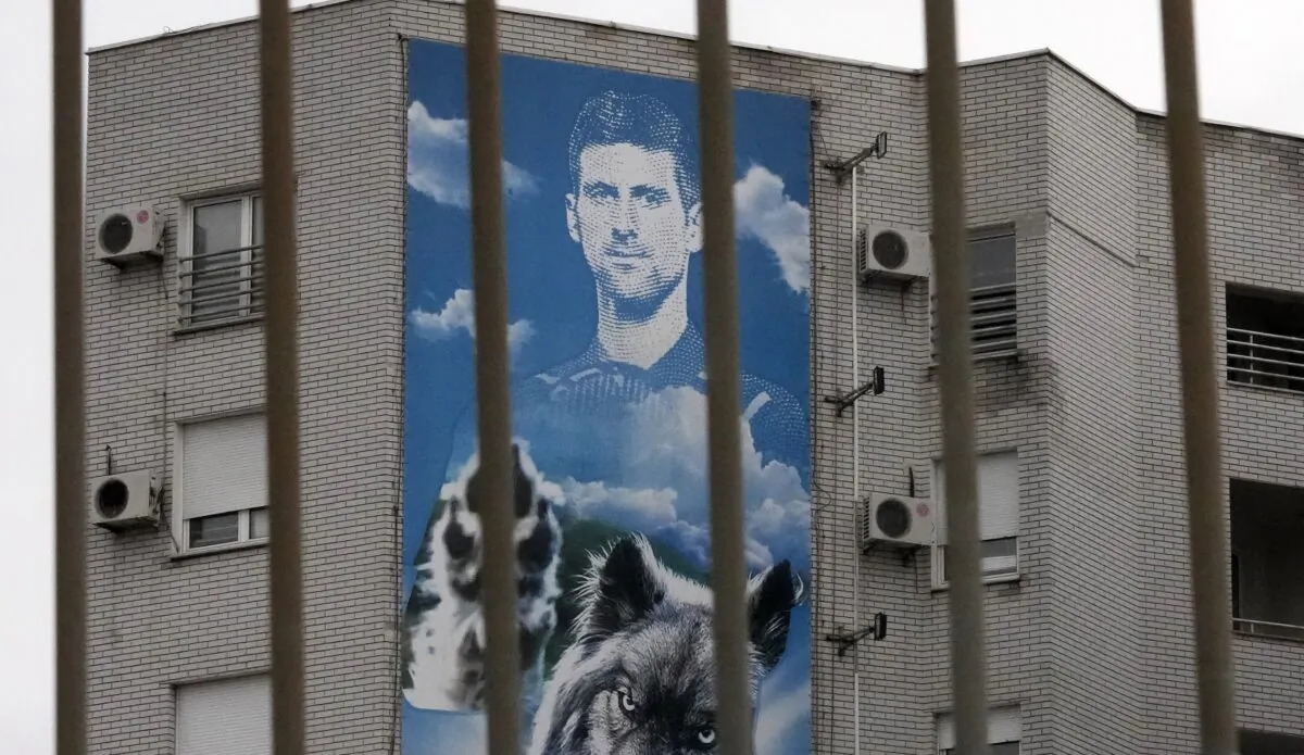 A billboard depicting Serbian tennis player Novak Djokovic hangs on a building in Belgrade, Serbia, on Jan. 6, 2022. (Darko Vojinovic/AP Photo)