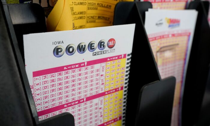 Blank forms for the Powerball lottery sit in a bin at a local grocery store, in Des Moines, Iowa, on Jan. 12, 2021. (Charlie Neibergall/AP Photo)