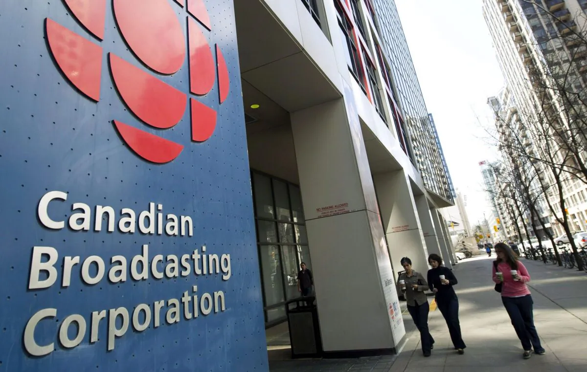 People walk toward the CBC building in Toronto in a file photo. (Nathan Denette/The Canadian Press)