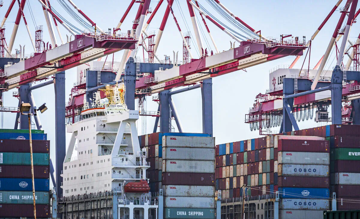 A cargo ship awaits the offloading of shipping containers in the Port of Los Angeles on Oct. 27, 2021. (John Fredricks/The Epoch Times)