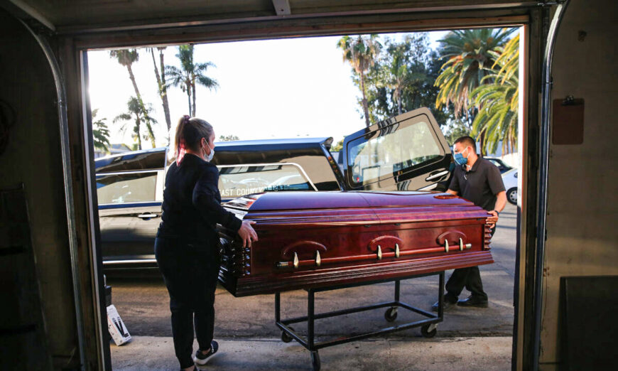 Workers load the casket into a hearse at East County Mortuary in El Cajon, Calif., on Jan. 15, 2021. (Mario Tama/Getty Images)