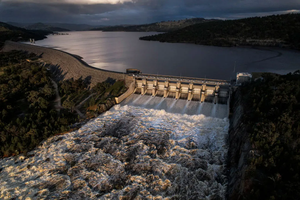 In this aerial view the Wyangala Dam is pictured as it spills after reaching 104% capacity  in Wyangala, Australia on November 15, 2021. (Photo by Brook Mitchell/Getty Images)