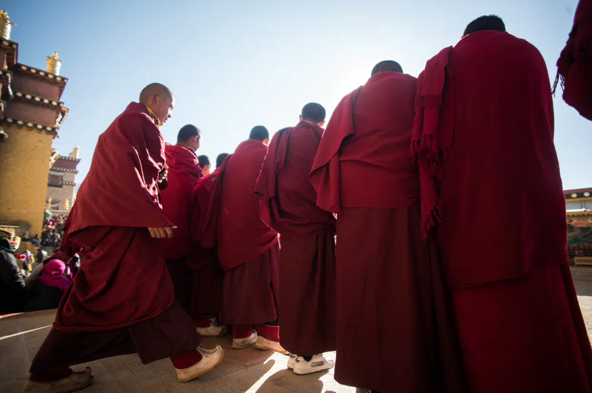 Lamas are watching the Cham dance during the Gedong festival at the Ganden Sumtsenling Monastery in Shangri-La, southwestern China's Yunnan Province, on Jan. 5, 2016. (Johannes Eisele/AFP via Getty Images)