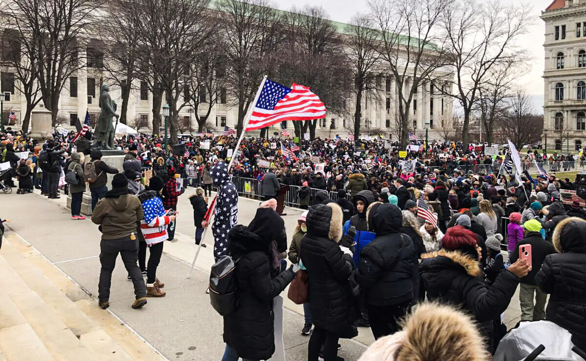 Protesters gather outside New York State Capitol to protest against proposed policies related to COVID-19 vaccine mandates in Albany, N.Y., on Jan. 5, 2022. (Bill Pan/The Epoch Times)
