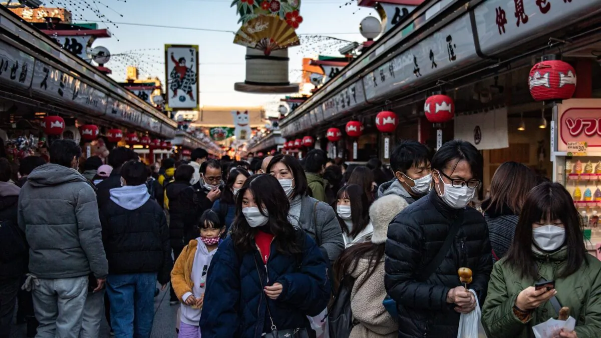 People visit a shopping street near Sensoji Temple in Tokyo, on Dec. 29, 2021. (Philip Fong/AFP via Getty Images)