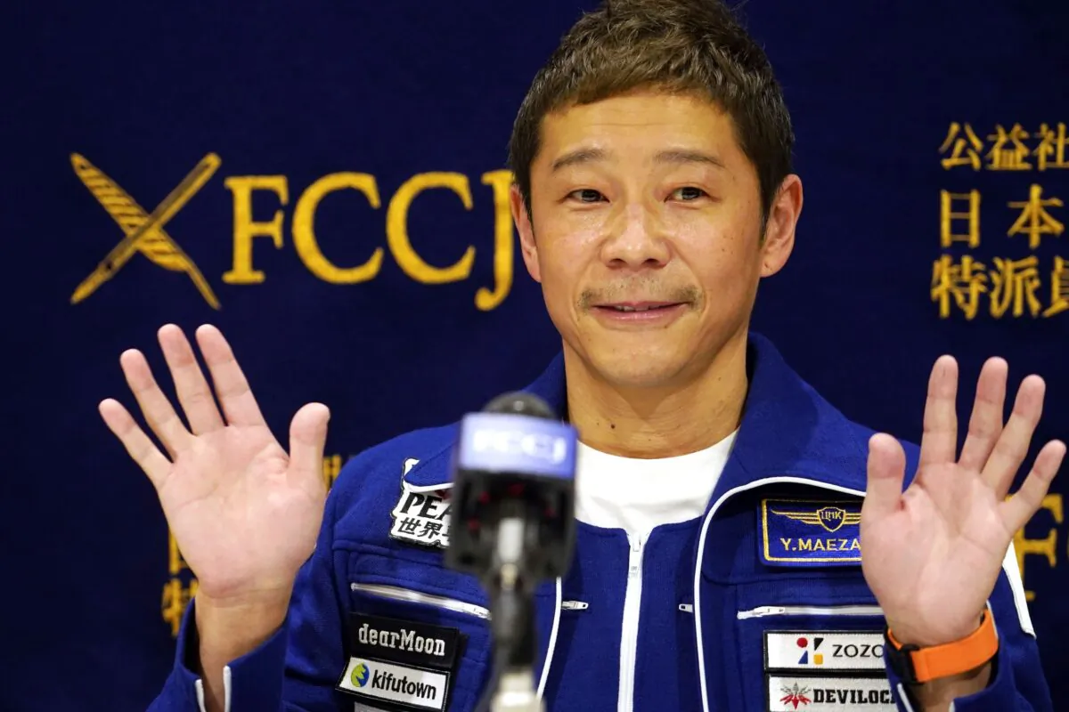 Japanese billionaire Yusaku Maezawa waves during a press conference at the Foreign Correspondents Club in Tokyo, on Jan. 7, 2022. (Eugene Hoshiko/AP Photo)