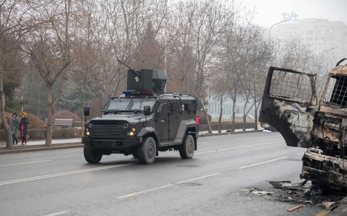 A military vehicle moves along a street, after violence that erupted following protests over hikes in fuel prices in central Almaty, Kazakhstan, on Jan. 7, 2022. (Alexandr Bogdanov/AFP via Getty Images)